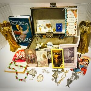 Vintage train case filled with angel prayer cards, art, books, religious jewelry